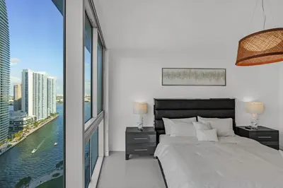 a bedroom with a large bed and a large window at icon Brickell 2 bed 2bath at W residence in Miami