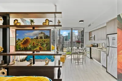 a kitchen and living room with a view of a city at Miami Penthouse Infinity Pool in Miami