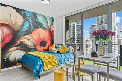a bedroom with a large flower mural on the wall at Miami Penthouse Infinity Pool in Miami