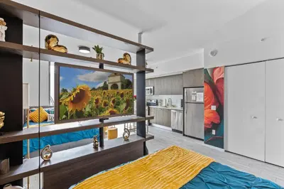 a living room with a television on a shelf at Miami Penthouse Infinity Pool in Miami