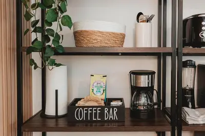 a shelf with a coffee bar sign on it at Cozy Miami Suite with FREE Parking in Miami