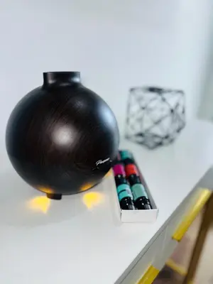 a black ball sitting on a table next to some bullets at Modern Home with large private yard - Next to downtown & beach & airport - Pet friendly in Fort Lauderdale