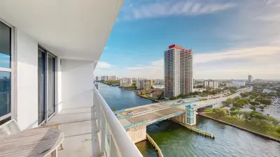 a balcony with a view of a river and a bridge at Hyde Beach House 3BR2BA in Hollywood