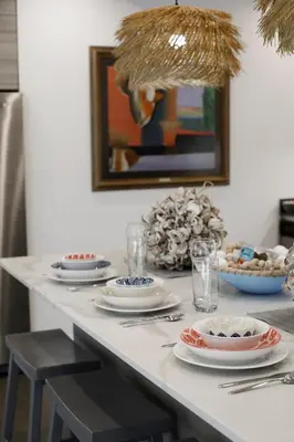 a table with plates and silverware on top of it at Stunning, Modern and Quiet Beach House in Hollywood