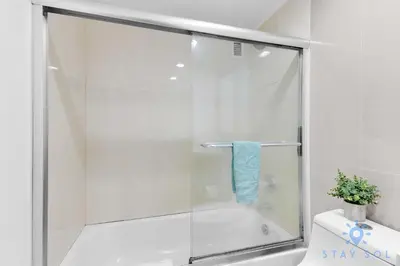 a shower with a glass door in a bathroom at Tides beautiful ocean view condo-promotions in Hollywood