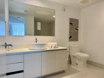 a bathroom with a sink and a toilet at Hallandale Beach Apmt 1B1B with Beach Service & Pool Service in Hallandale Beach