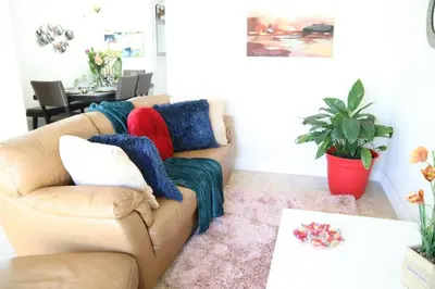a living room with a couch with pillows on it at Luxury DreamStay Miami 3BED 2BATH King Suite in Burrs Strip