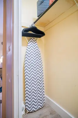 a tie hanging on a shelf in a closet at Hidden Gem Luxe 1 BEDROOM & Patio in Cutler Bay