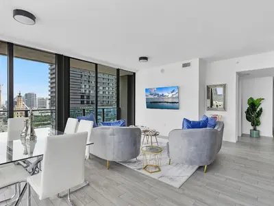 a living room with a view of a city at X Lounge V-Panoramic Private Residence in Miami