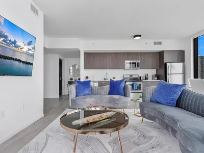 a living room with a couch and a table at X Lounge V-Panoramic Private Residence in Miami