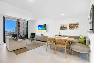 a living room with a table and a dining room at Modern Stylish 1BR Apartment with Pool in Miami