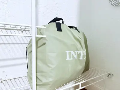 a bag sitting on a shelf in a closet at Retreat in Style Private Peaceful Miami Bungalow in Olympia Heights