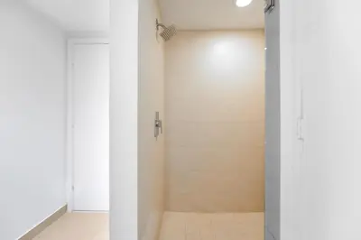 a shower with a glass door in a bathroom at Stunning Oceanfront Escape & Luxury Resort Living in Hollywood