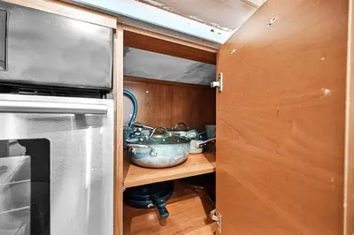 a kitchen with a pot on a shelf next to a stove at Exclusive unit in Miami Sunshine in Miami
