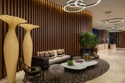 a living room with a couch and a table at Ventur Luxe Condo - Oceanview - Gym, Beach Access in Hollywood