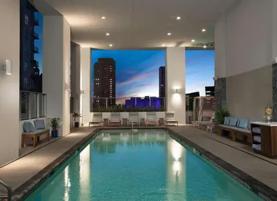 a pool in a building with a view of a city at Designer Studio Downtown Miami with Rooftop Pool and Gym in Miami