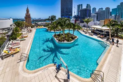 an overhead view of a large swimming pool with a city skyline at Exquisite 2 Bedroom in the best location of Downtown Miami in Miami