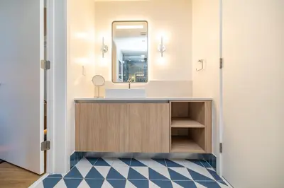 a bathroom with a sink and a mirror at Exquisite 2 Bedroom in the best location of Downtown Miami in Miami