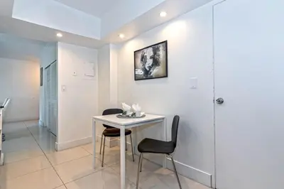 a dining room with a table and two chairs at Direct access to the beach, pool and parking 3T in Hollywood