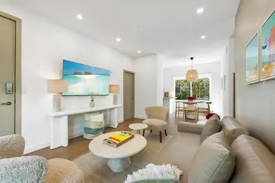 a living room with a couch and a table at Lux Designer Apt 2BR and 2BA in the Heart of MIA Beach in Miami Beach