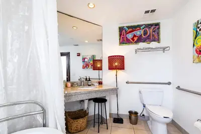 a bathroom with a sink and a toilet at Oceanfront Oasis 2-BR Apartment on Ocean Drive in Miami Beach
