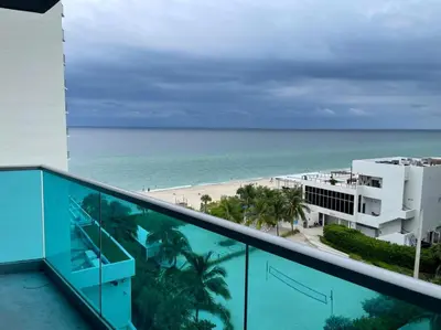 a view of the beach from the balcony of a resort at Ocean view-Large 2bedroom Remodeled on the beach in Hollywood