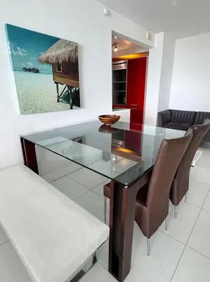 a dining room with a glass table and chairs at Ocean view-Large 2bedroom Remodeled on the beach in Hollywood