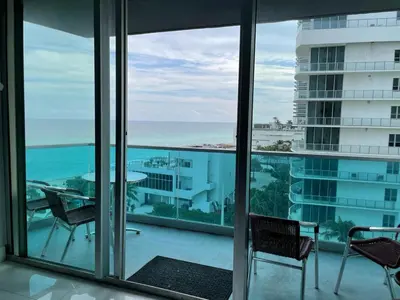 a view of the ocean from the balcony of a building at Ocean view-Large 2bedroom Remodeled on the beach in Hollywood