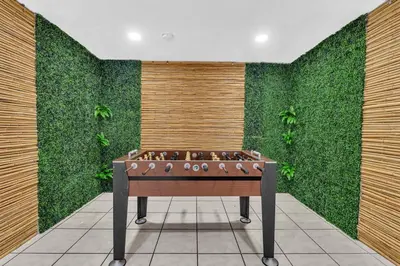 a foosball table in front of a green wall at Hollywood Beach & Casino Heated Pool House in Hollywood