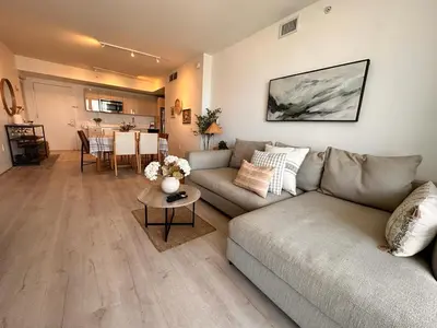 a living room with a couch and a table at Apartment in Miami Beach with Kitchen, Beach Service and Gym in Hallandale Beach