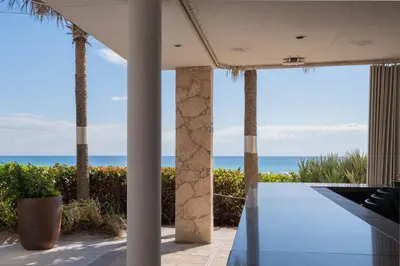 a view of the ocean from the patio of a house at Miami Apt with Amazing Views & Kitchen in Hallandale Beach