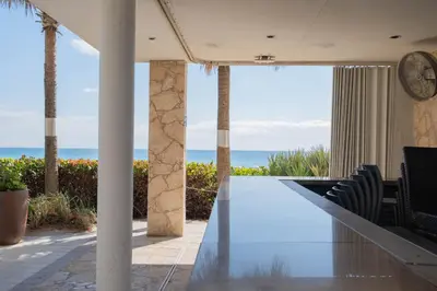 a dining room with a view of the ocean at Amazing Studio Cozy at the Beach close to Mall in Hallandale Beach