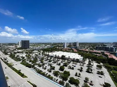 an aerial view of a city with a parking lot at Oceanview studio with Pool & Beach in Hallandale Beach