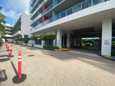 a building with red and white cones in front of it at BeachWalk Studio Apmt 2 Beds w Beach Service in Hallandale Beach