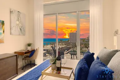 a living room with a view of the ocean at Stylish Nice Apt Hollywood Beach Boardwalk in Hollywood