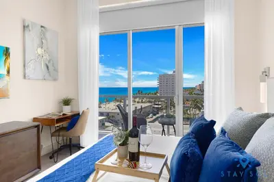 a living room with a view of the ocean at Stylish Nice Apt Hollywood Beach Boardwalk in Hollywood