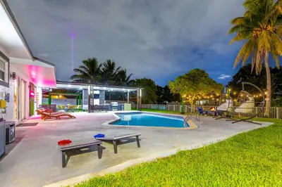 a swimming pool in the backyard of a house at Hard Rock Paradise in Andover Lakes Estates