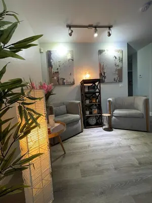 a living room with two couches and a table at La Dolce Villa in Fort Lauderdale