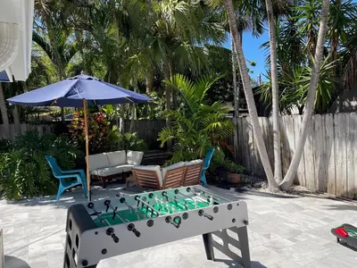 a pool table with a chessboard on a patio at La Dolce Villa in Fort Lauderdale
