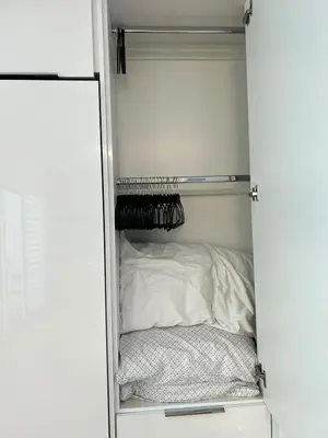 a small closet with a bed in it at Fully Equipped Modern Loft in the heart of Miami in Miami