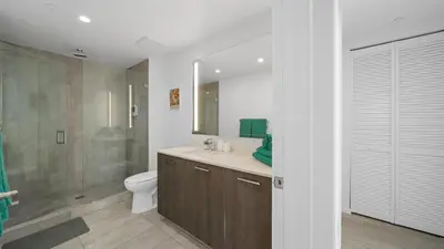 a bathroom with a sink and a toilet and a shower at 2-Bedr Downtown Miami Condo Bay Views in Miami