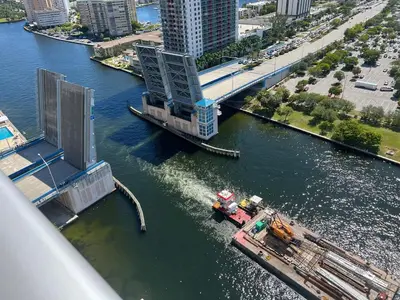 a bridge over a river with a boat in the water at Best Apartment next to Hollywood Beach 2B 2B in Hollywood