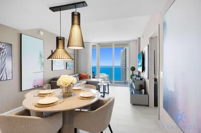 a dining room and living room with a table and chairs at Bay View 2Br Apartment with Amenities in Hollywood