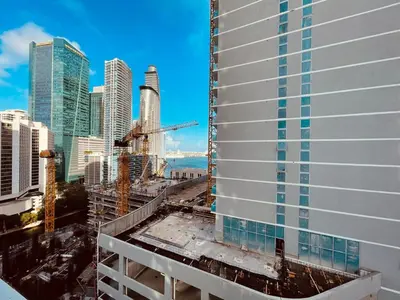 a view of a tall building under construction at BrickellRiver LOFT with parking & 12 min to South Beach in Miami