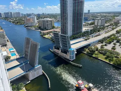 an aerial view of a river with a bridge at Beachfront Apt with Gym, Pool, and Rest in Miami in Hollywood