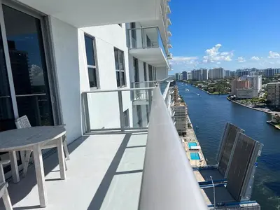 a balcony of a building with a view of a river at Apt Hyde, Beach, Pool, and Resort Amenities in Miami in Hollywood