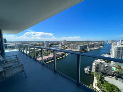 a balcony with a view of a river and buildings at Apt Hyde, Beach, Pool, and Resort Amenities in Miami in Hollywood