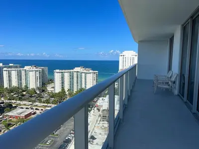 a balcony with a view of the ocean and buildings at Hyde Luxury 2 Bedroom Apartment in Miami Beach and Pool in Hollywood