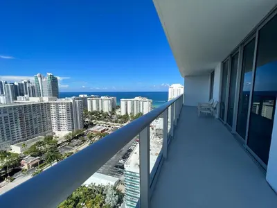 a balcony of a building with a view of the ocean at Hyde Luxury 2 Bedroom Apartment in Miami Beach and Pool in Hollywood