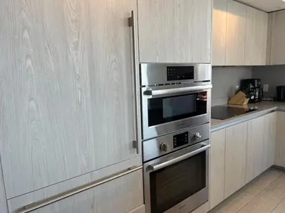 a kitchen with stainless steel ovens and cabinets at Hyde Luxury 2 Bedroom Apartment in Miami Beach and Pool in Hollywood